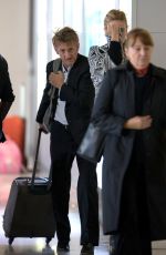 CHARLIZE THERON and Sean Penn Share a Kiss at LAX Airport