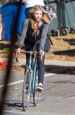 CHLOE MORETZ Riding a Bike on the Set of the 5th Wave in Atlanta