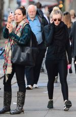 DAKOTA FANNING in Tights Out and About in New York