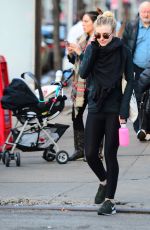 DAKOTA FANNING in Tights Out and About in New York