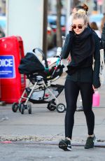 DAKOTA FANNING in Tights Out and About in New York