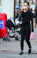 DAKOTA FANNING in Tights Out and About in New York