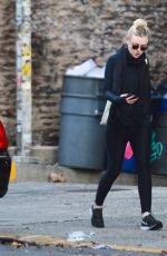 DAKOTA FANNING in Tights Out and About in New York