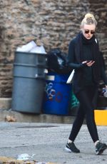 DAKOTA FANNING in Tights Out and About in New York