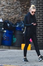 DAKOTA FANNING in Tights Out and About in New York