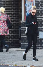 DAKOTA FANNING in Tights Out and About in New York