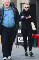 DAKOTA FANNING in Tights Out and About in New York