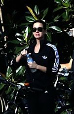 KATY PERRY in Tights Riding a Bicycle Out in Perth