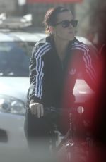 KATY PERRY in Tights Riding a Bicycle Out in Perth