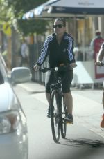 KATY PERRY in Tights Riding a Bicycle Out in Perth
