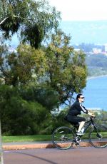 KATY PERRY in Tights Riding a Bicycle Out in Perth