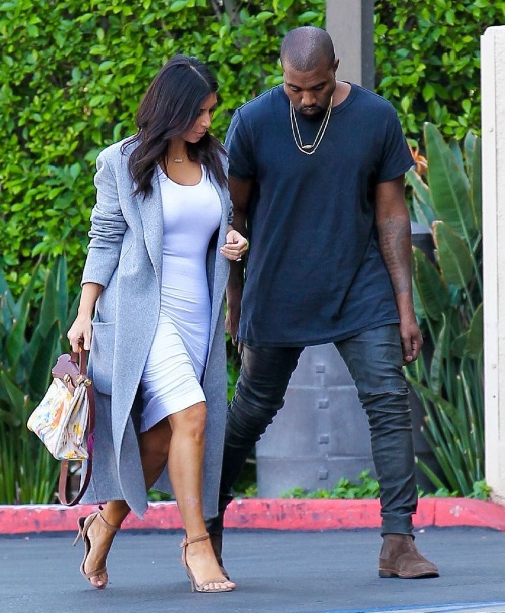 KIM KARDASHIAN and Kanye West Arrives at Jenner cCommunications in Woodland Hills KIM KARDASHIAN and Kanye West Arrives at Jenner cCommunications in Woodland Hills
