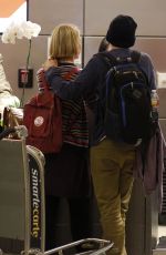 MIA WASIKOWSKA and Jesse Eisenberg Arrives at LAX Airport in Los Angeles