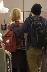 MIA WASIKOWSKA and Jesse Eisenberg Arrives at LAX Airport in Los Angeles