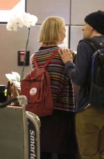MIA WASIKOWSKA and Jesse Eisenberg Arrives at LAX Airport in Los Angeles