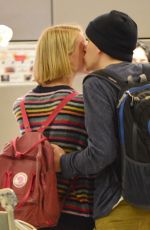 MIA WASIKOWSKA and Jesse Eisenberg Arrives at LAX Airport in Los Angeles