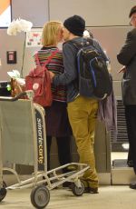 MIA WASIKOWSKA and Jesse Eisenberg Arrives at LAX Airport in Los Angeles