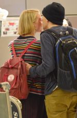 MIA WASIKOWSKA and Jesse Eisenberg Arrives at LAX Airport in Los Angeles