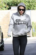 MILEY CYRUS Walks Her Dog Out in Los Angeles