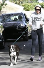 MILEY CYRUS Walks Her Dog Out in Los Angeles