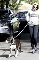 MILEY CYRUS Walks Her Dog Out in Los Angeles