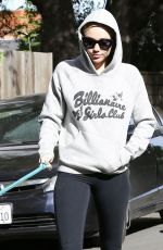 MILEY CYRUS Walks Her Dog Out in Los Angeles