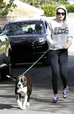 MILEY CYRUS Walks Her Dog Out in Los Angeles
