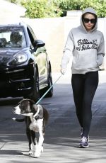 MILEY CYRUS Walks Her Dog Out in Los Angeles