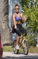 NINA AGDAL in Sport Bra and Leggings Riding a Bike Out in Miami