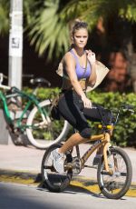 NINA AGDAL in Sport Bra and Leggings Riding a Bike Out in Miami