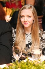 AMANDA SEYFRIED at 2014 Acria Holiday Dinner in New York