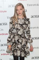 AMANDA SEYFRIED at 2014 Acria Holiday Dinner in New York