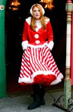BELLA THORNE as Santa