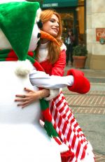 BELLA THORNE as Santa