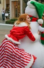 BELLA THORNE as Santa