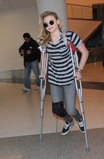 CHLOE MORETZ Sports Knee Brace at LAX Airport in Los Angeles