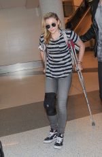 CHLOE MORETZ Sports Knee Brace at LAX Airport in Los Angeles