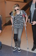 CHLOE MORETZ Sports Knee Brace at LAX Airport in Los Angeles