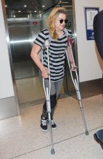 CHLOE MORETZ Sports Knee Brace at LAX Airport in Los Angeles