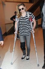 CHLOE MORETZ Sports Knee Brace at LAX Airport in Los Angeles