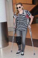 CHLOE MORETZ Sports Knee Brace at LAX Airport in Los Angeles