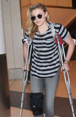 CHLOE MORETZ Sports Knee Brace at LAX Airport in Los Angeles