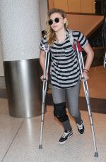 CHLOE MORETZ Sports Knee Brace at LAX Airport in Los Angeles