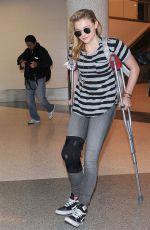 CHLOE MORETZ Sports Knee Brace at LAX Airport in Los Angeles