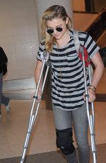 CHLOE MORETZ Sports Knee Brace at LAX Airport in Los Angeles