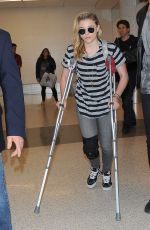 CHLOE MORETZ Sports Knee Brace at LAX Airport in Los Angeles