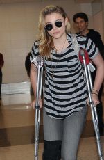CHLOE MORETZ Sports Knee Brace at LAX Airport in Los Angeles