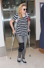 CHLOE MORETZ Sports Knee Brace at LAX Airport in Los Angeles