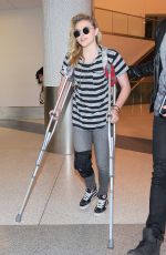 CHLOE MORETZ Sports Knee Brace at LAX Airport in Los Angeles