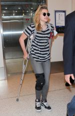 CHLOE MORETZ Sports Knee Brace at LAX Airport in Los Angeles